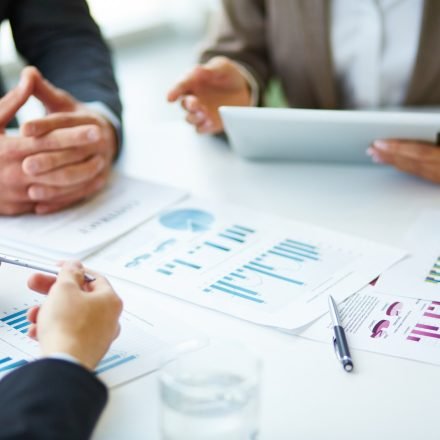 close-up-businesspeople-working-with-documents_1098-1263